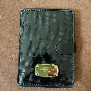 Michael Kors Black Perforated Signature
Patent Leather Passport Holder